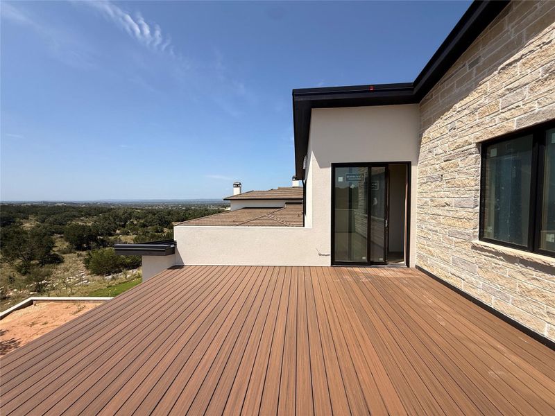 An inviting deck extends from the dwelling, providing an expansive vantage point of the surrounding landscape. An inviting deck extends from the dwelling, providing an expansive vantage point of the surrounding landscape.