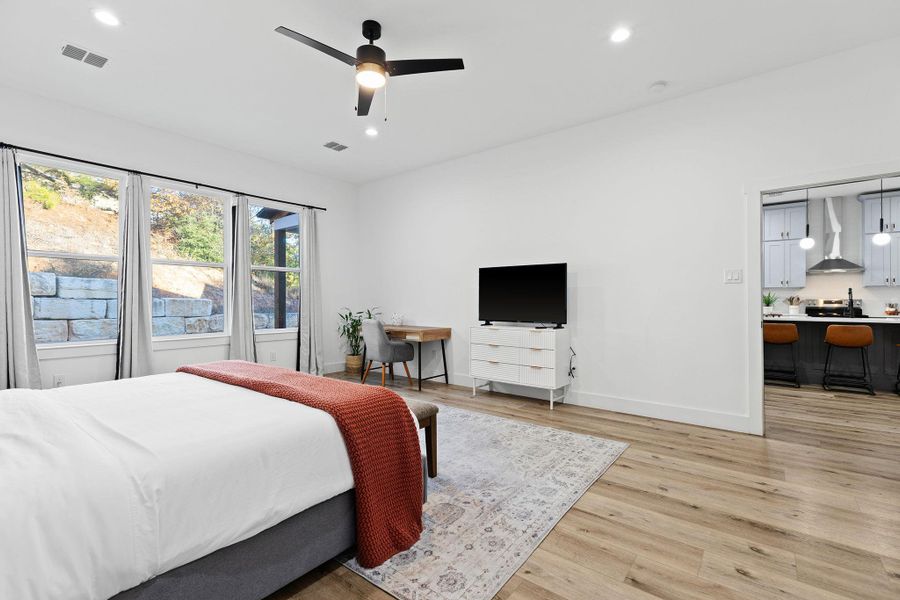 Bedroom with ceiling fan, light wood finished floors, and recessed lighting