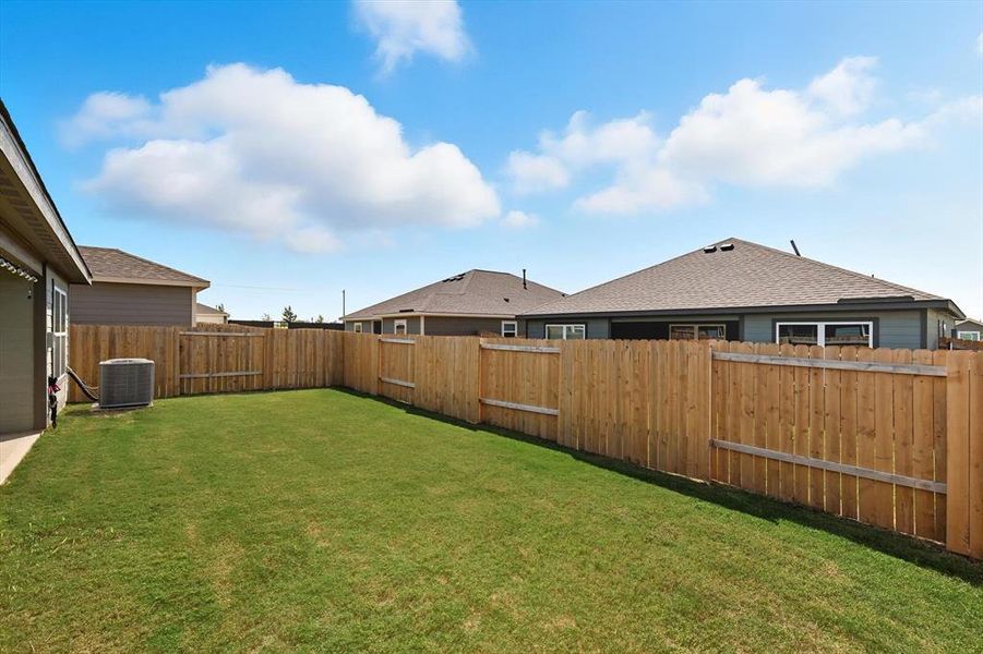 View of fenced backyard