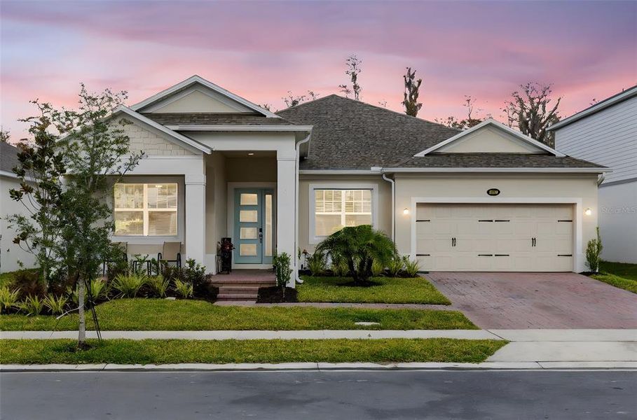 Front exterior of a new home in Eden at Crossprairie, St. Cloud, FL, highlighting curb appeal (Image 2).