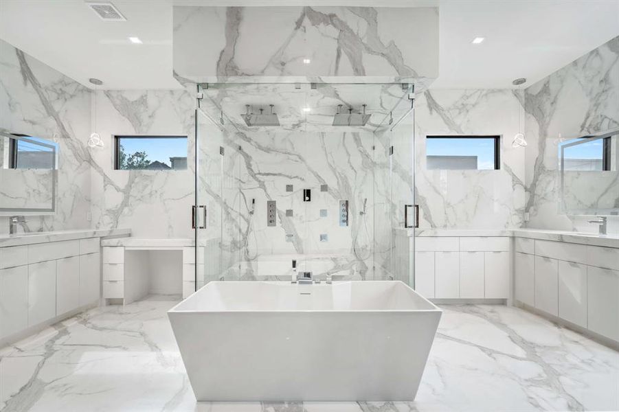 Double sinks, oversized soaking tub, steam and rain shower. Total luxury.