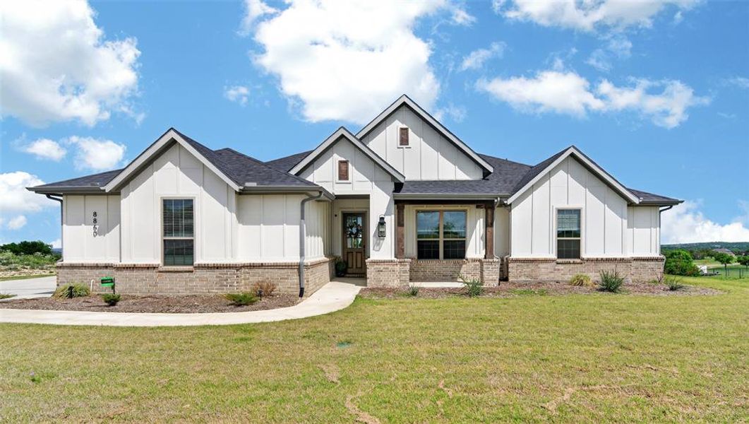 Front exterior of a new home in Gatlin Ranch, Springtown, TX, highlighting curb appeal (Image 21).