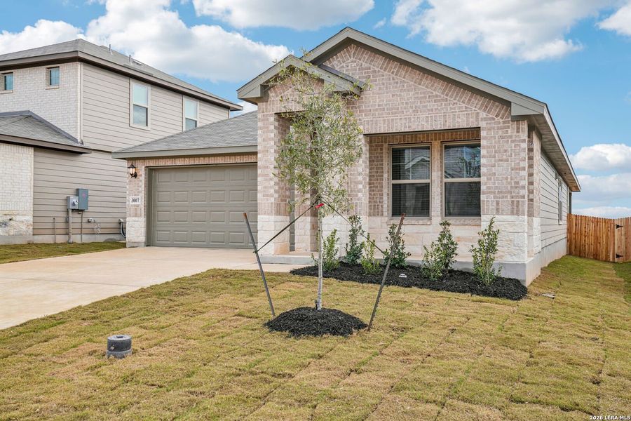 Front exterior of a new home in Lark Canyon, New Braunfels, TX, highlighting curb appeal (Image 20).