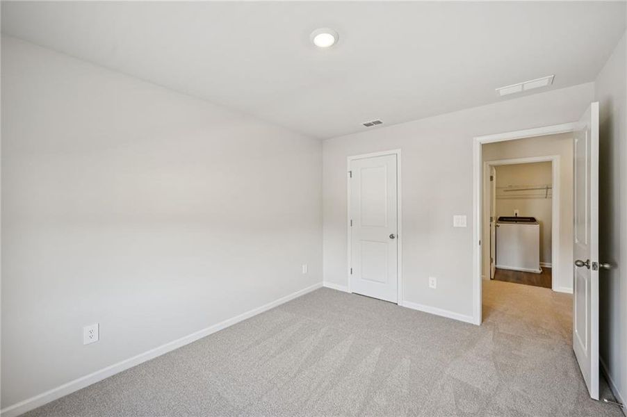 Spacious, unfurnished interior of a new home in Creekside at Oxford Park, Fairburn (Image 33).