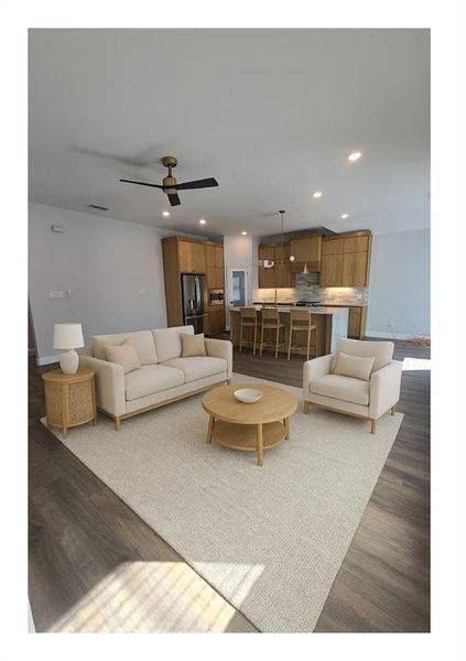 Living room with recessed lighting, dark wood-style floors, and ceiling fan
