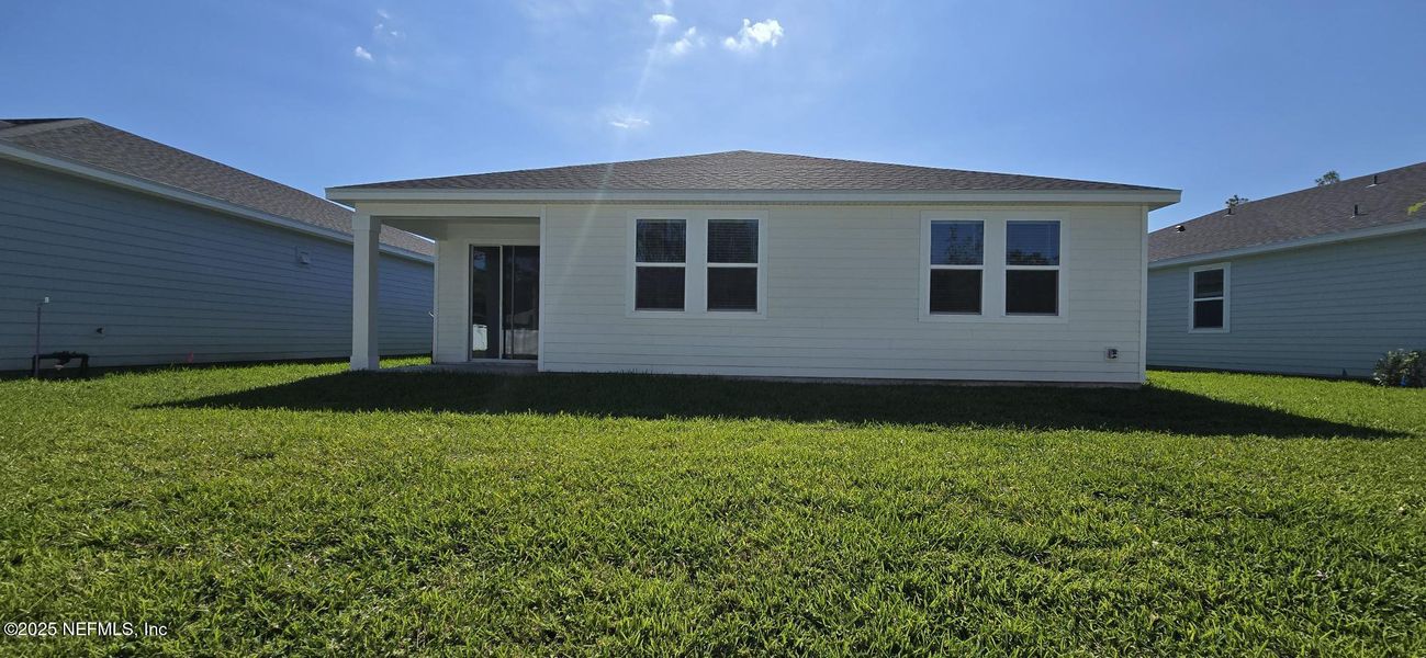 Exterior details and patio area of a home in Flagler Village - Signature Series, Palm Coast (Image 3).