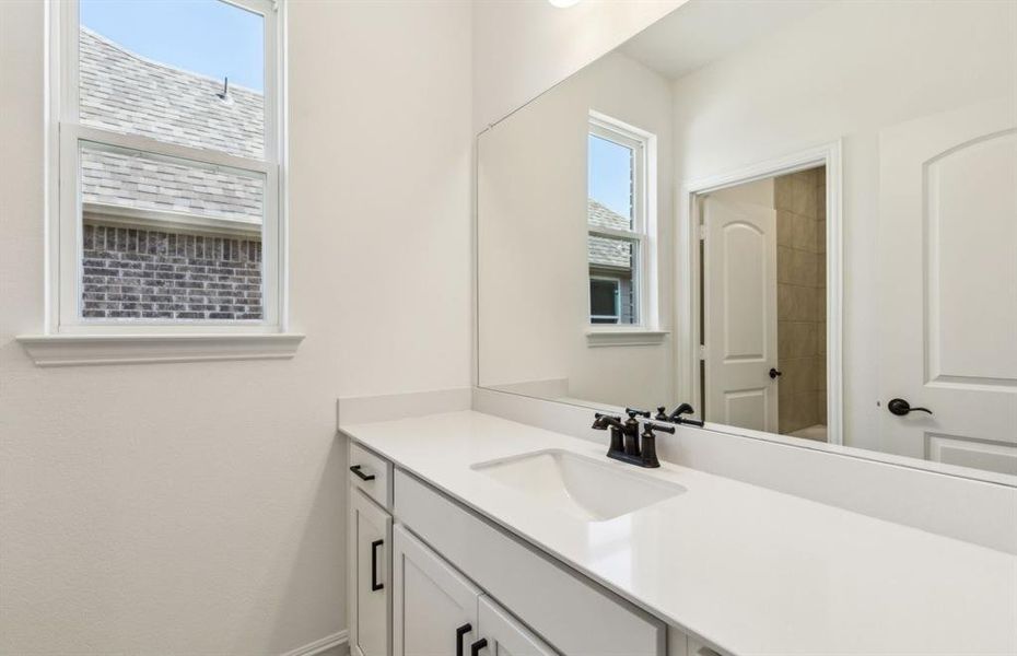 Stylish secondary bath with high-end fixtures *Real home pictured