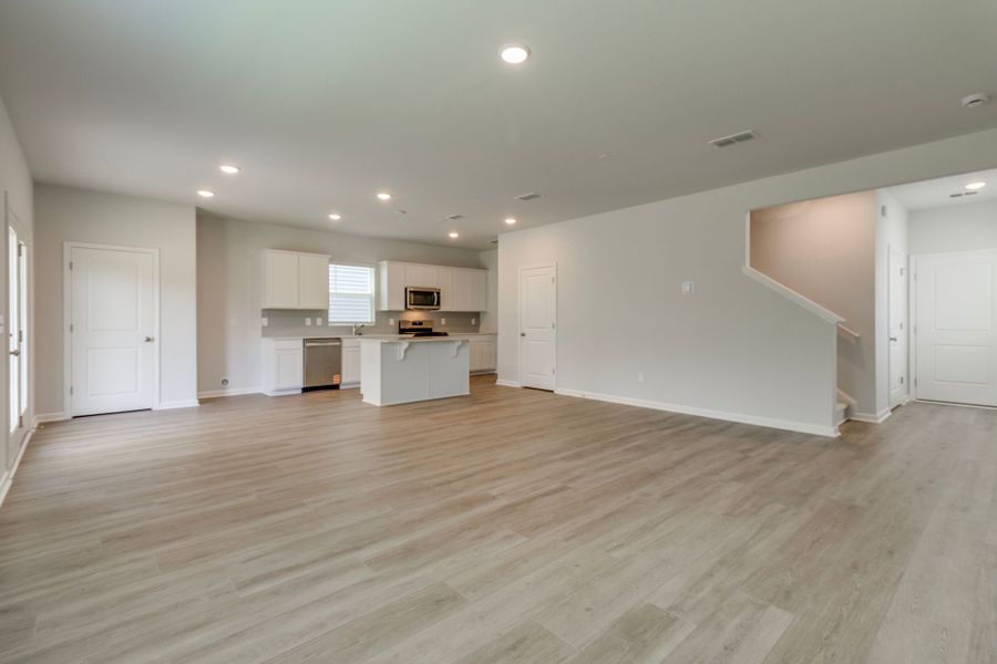 The large gathering room serves as the heart of the home, guests to come together.