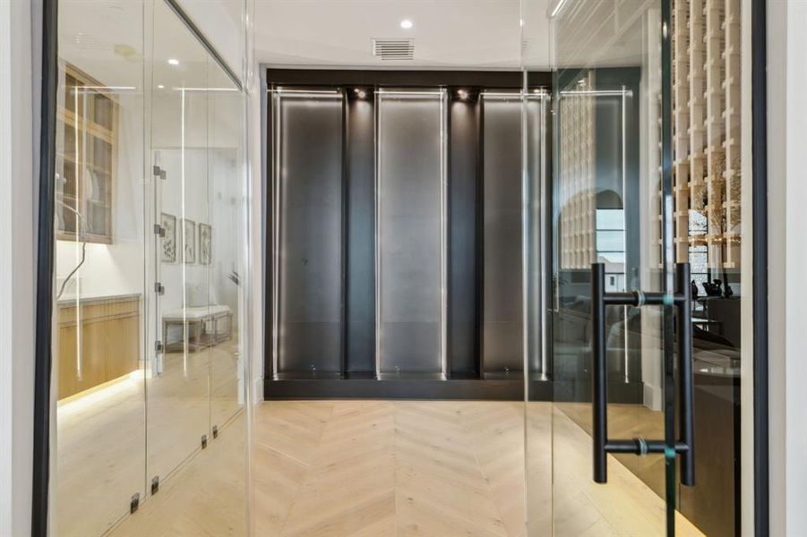 Beautiful wine cellar with glass walls, herringbone white oak floors Beautiful wine cellar with glass walls, herringbone white oak floors