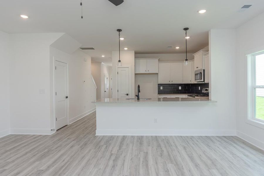 Representative unfurnished interior of a home built from the 1692 Townhome by Adams Homes in Parkstone Place Townhomes, Roebuck (Image 10).
