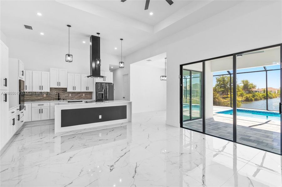 Kitchen and Living Room overlook the pool and water views