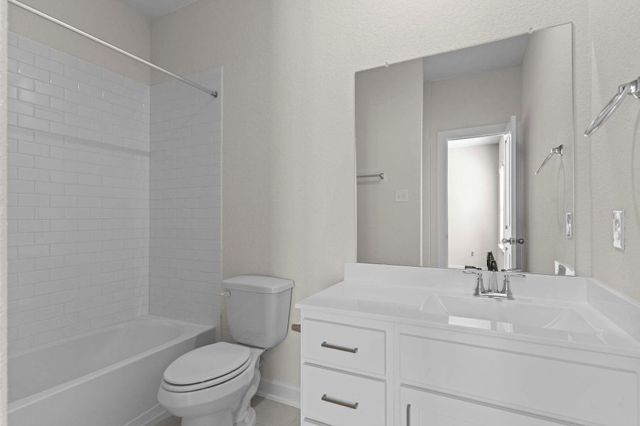 Upstairs secondary bath with tub/shower combo, vanity, and modern fixtures designed for both style and convenience. Perfect for that teenager in your life! Upstairs secondary bath with tub/shower combo, vanity, and modern fixtures designed for both style and convenience. Perfect for that teenager in your life!
