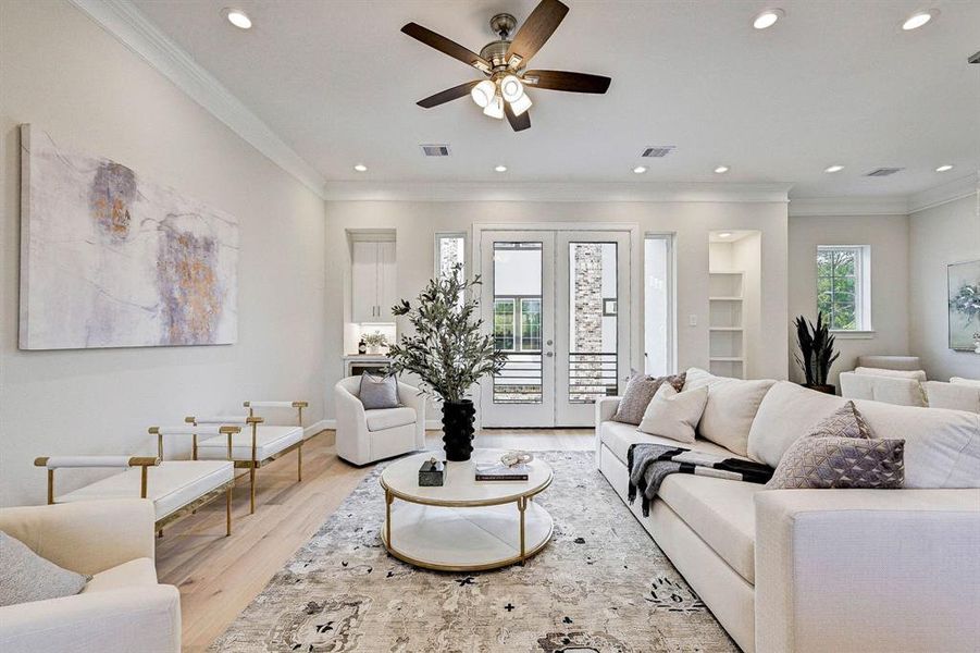 Spacious Living Room with French Doors that gives you access to a private balcony. Notice the dry bar at the corner. Perfect for entertaining.