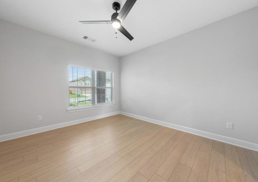 The master bedroom is large and has a window that allows in great natural light.