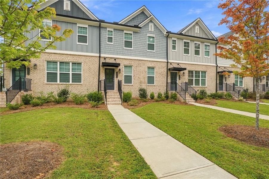 Front exterior of a new home in , Sugar Hill, GA, highlighting curb appeal (Image 24).
