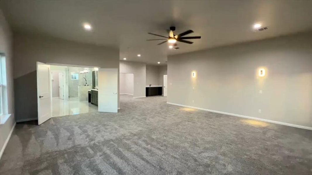 Unfurnished living room with carpet, recessed lighting, and ceiling fan