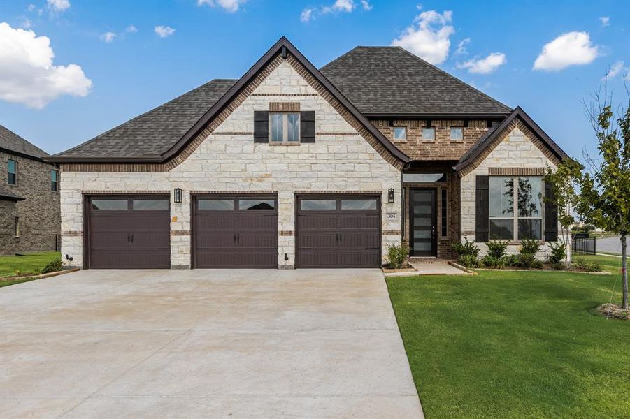 Front exterior of a new home in Heath Golf and Yacht, Heath, TX, highlighting curb appeal (Image 18).