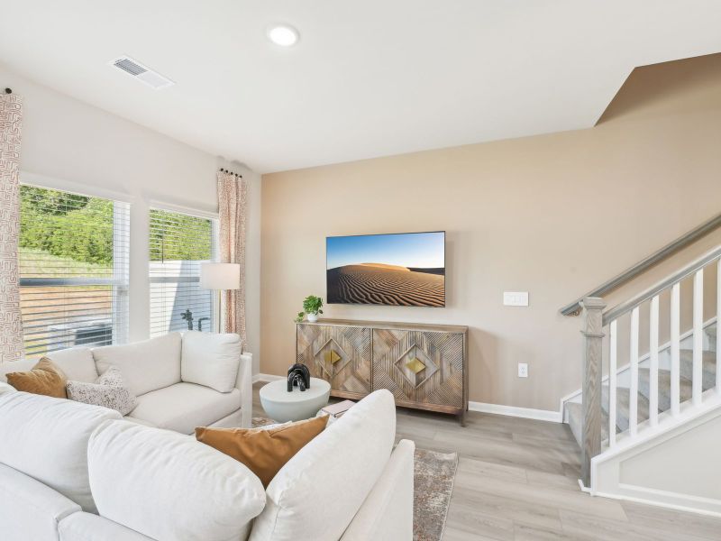 Great room in the Topaz floorplan at a Meritage Homes community in Mebane, NC.