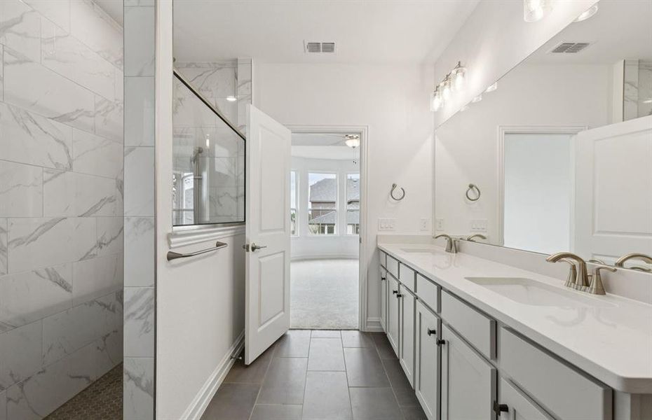 Elegant owner's bathroom with dual vanity and oversized shower Elegant owner's bathroom with dual vanity and oversized shower