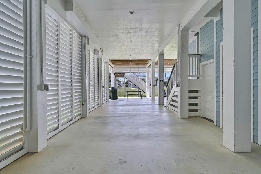 The oversized covered area beneath the home creates a private outdoor retreat with endless possibilities for entertaining and relaxing and lots of parking.