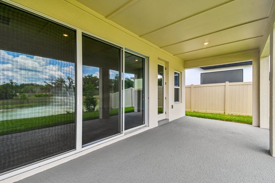 Exterior details and patio area of a home in Oakfield at Mount Dora Village Series, Mount Dora (Image 3).