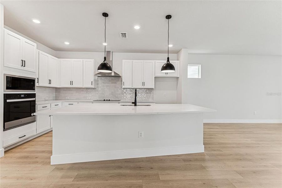 Furnished interior view inside a new home in North River Ranch - Cottage Series, Parrish (Image 7).