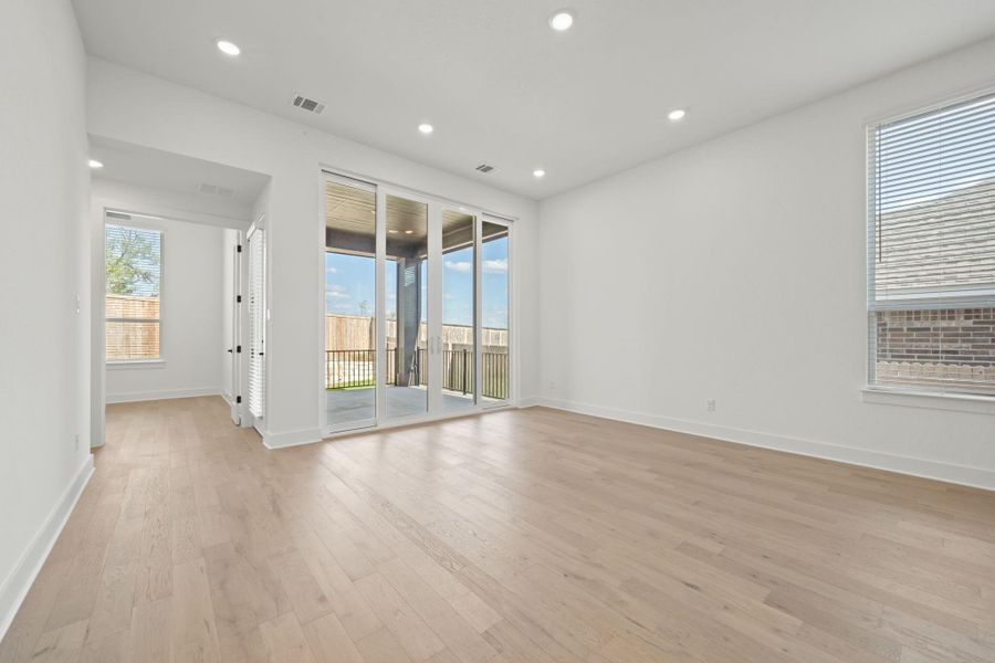 Spare room with light wood-type flooring and recessed lighting