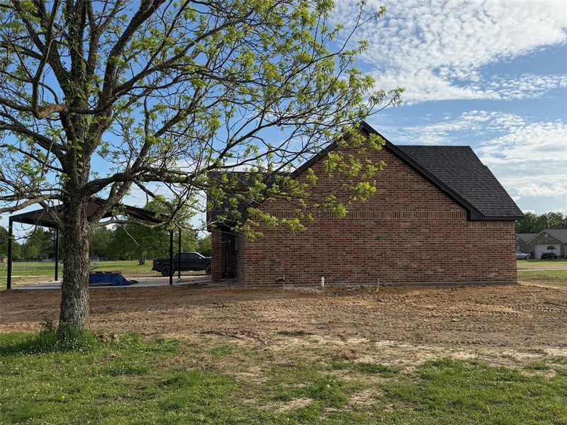 Exterior details and patio area of a home in , Powderly (Image 3).