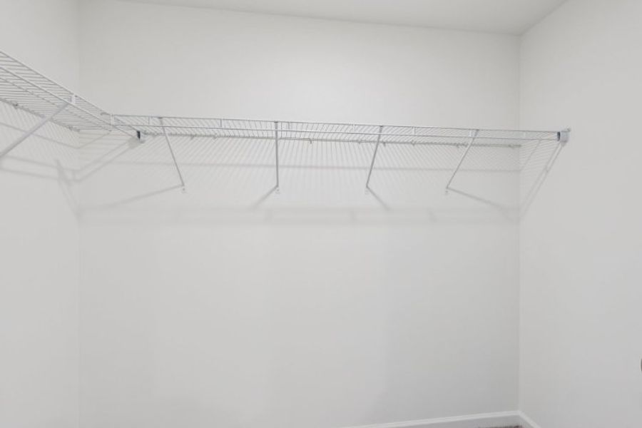 A white ceiling with a vent. A white ceiling with a vent.