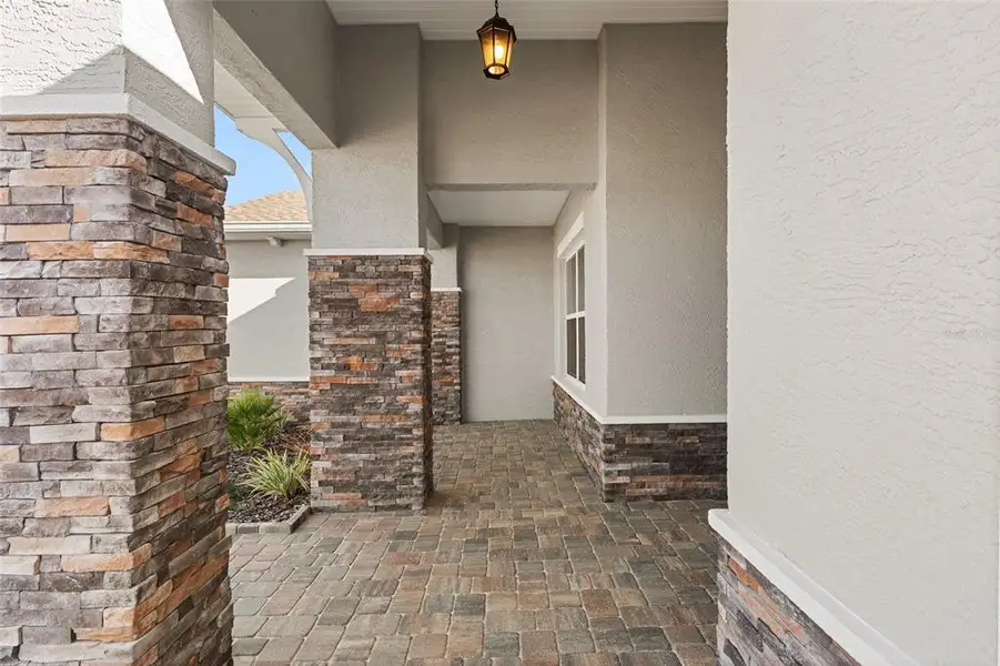 Exterior details and patio area of a home in , Ocala (Image 38).