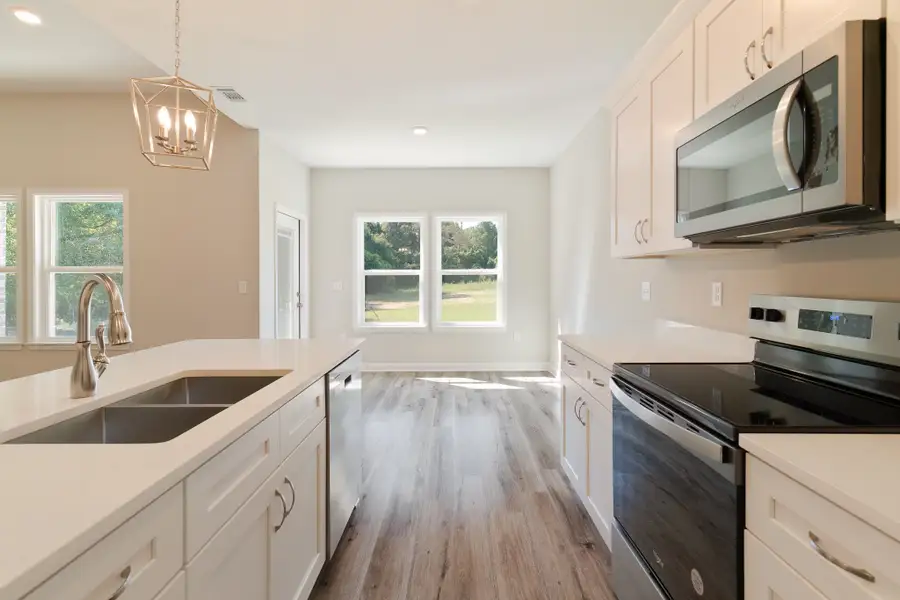 Representative furnished interior of a home built from the Maybell III by CJL Homes in McCarthy Estates, Defuniak Springs (Image 4).
