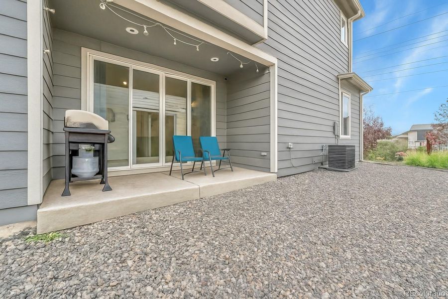 Exterior details and patio area of a home in Urban Collection at Copperleaf, Aurora (Image 1).