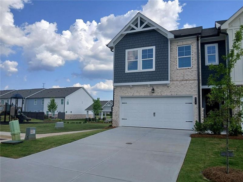 Front exterior of a new home in Union Village, McDonough, GA, highlighting curb appeal (Image 2). Front exterior of a new home in Union Village, McDonough, GA, highlighting curb appeal (Image 2).