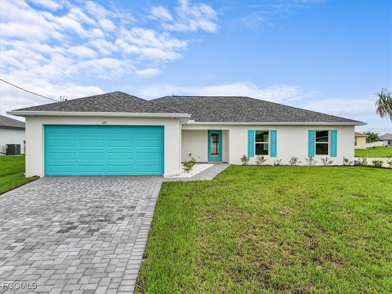 Front exterior of a new home in Cape Coral, Cape Coral, FL, highlighting curb appeal (Image 2). Front exterior of a new home in Cape Coral, Cape Coral, FL, highlighting curb appeal (Image 2).