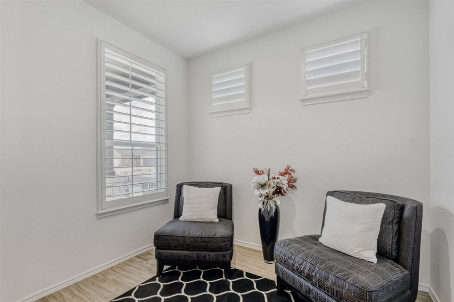 Living area with light wood-style flooring