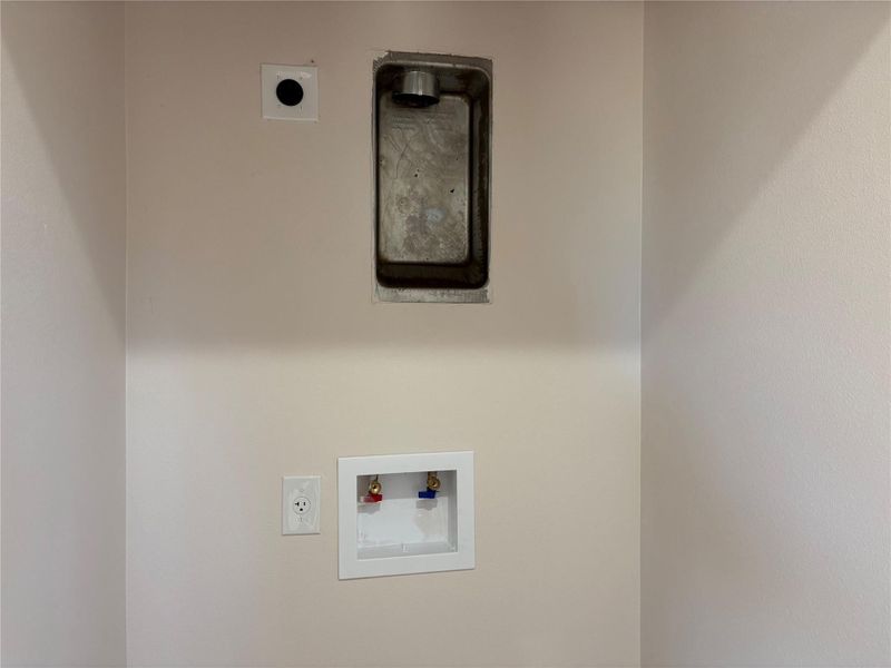 Laundry area with hookup for a washing machine and electric dryer hookup