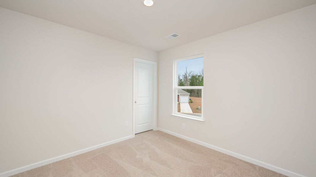 Spacious, unfurnished interior of a new home in Indigo Preserve, Leland (Image 22).