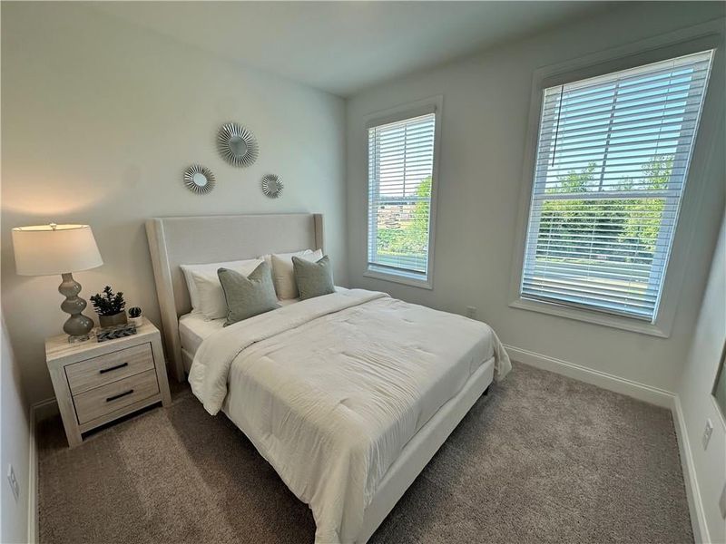 Guest Bedroom #2 features bright views of Sawnee Mountain *photos are from the Magnolia model at different home site*