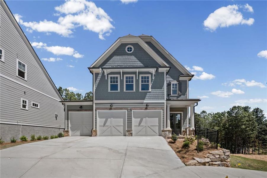 Front exterior of a new home in , Canton, GA, highlighting curb appeal (Image 2). Front exterior of a new home in , Canton, GA, highlighting curb appeal (Image 2).