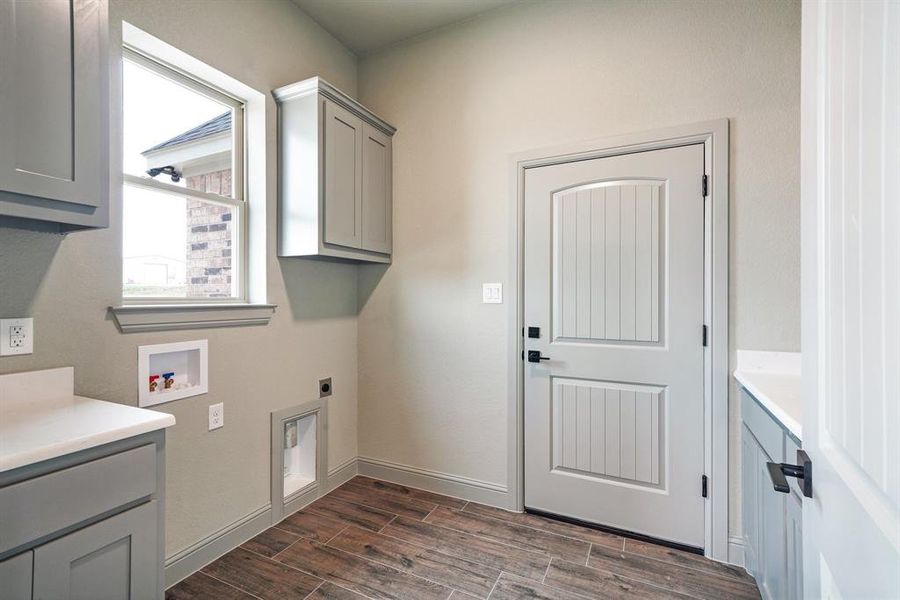 Utility room leads to garage.