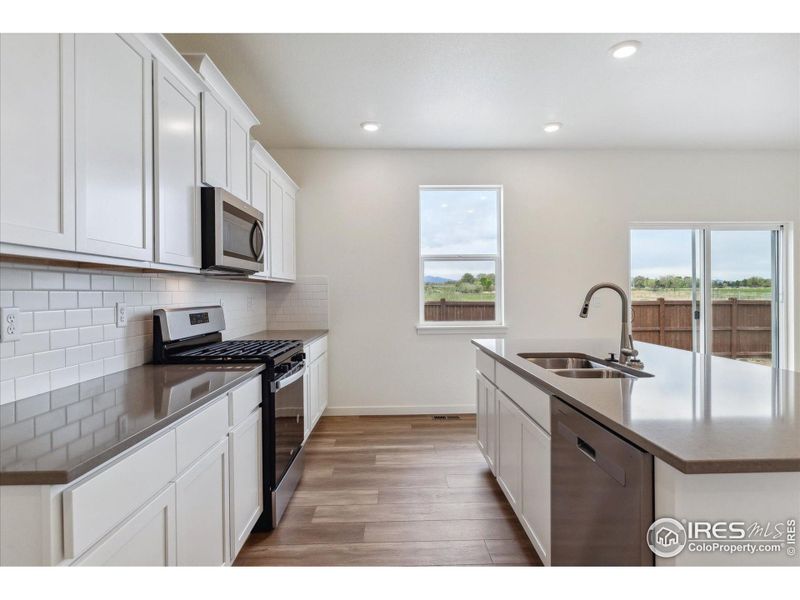 Furnished interior view inside a new home in Silver Peaks, Lochbuie (Image 5).