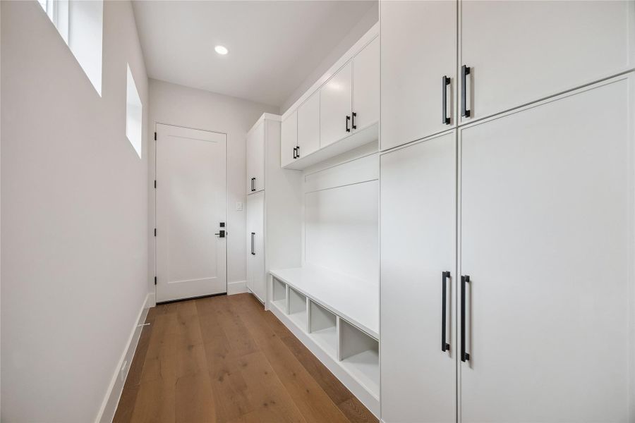 The first floor mud room adds practical everyday functionality with built-in storage, clean millwork, and direct access into the home. Designed to keep organization simple, the space blends naturally into the home’s modern finish palette. The first floor mud room adds practical everyday functionality with built-in storage, clean millwork, and direct access into the home. Designed to keep organization simple, the space blends naturally into the home’s modern finish palette.