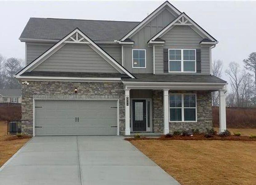 Front exterior of a new home in Highland Park, Stonecrest, GA, highlighting curb appeal (Image 1). Front exterior of a new home in Highland Park, Stonecrest, GA, highlighting curb appeal (Image 1).