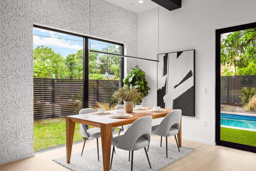 Dining space featuring baseboards and light wood-style flooring