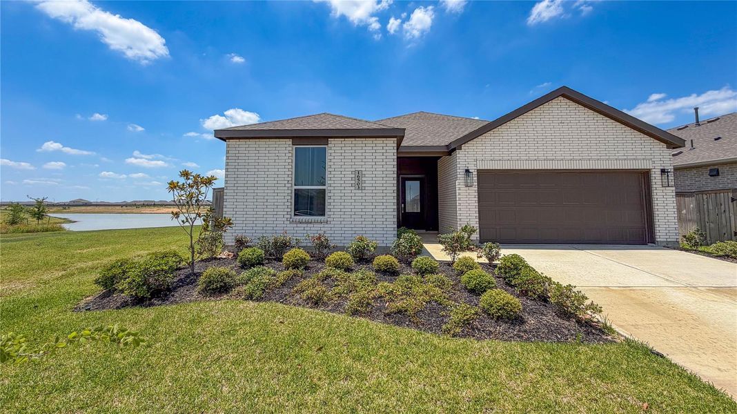Front exterior of a new home in The Grand Prairie, Hockley, TX, highlighting curb appeal (Image 2).
