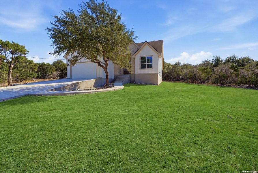 Front exterior of a new home in , Canyon Lake, TX, highlighting curb appeal (Image 26).