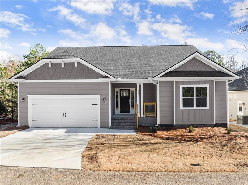 Front exterior of a new home in Chambers Landing, Commerce, GA, highlighting curb appeal (Image 21). Front exterior of a new home in Chambers Landing, Commerce, GA, highlighting curb appeal (Image 21).