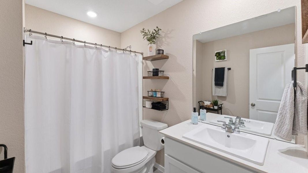 This bathroom features a clean, modern design with a neutral color palette.