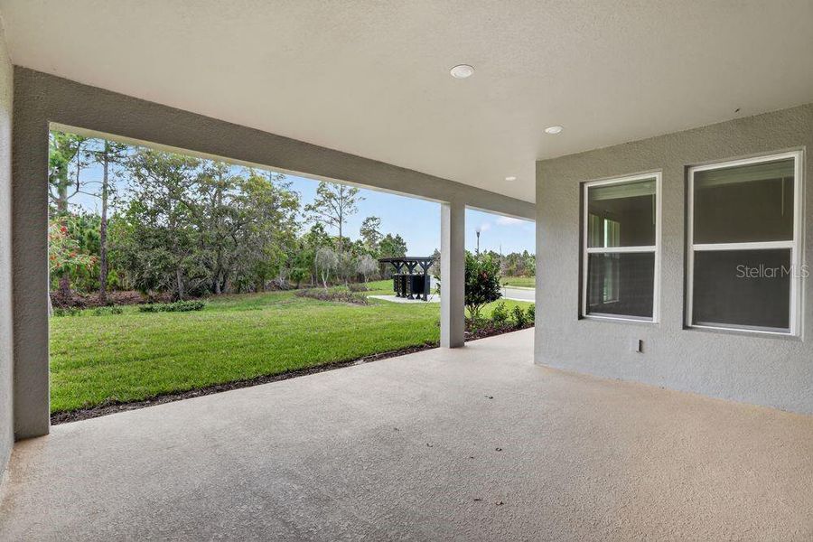 Exterior details and patio area of a home in Ardisia Park, New Smyrna Beach (Image 4).