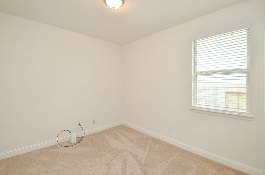 A Secondary Bedroom that would be Perfect used as a Home Office.